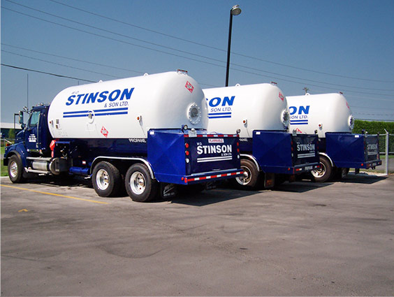 Image of three Stinson delivery trucks in a parking lot