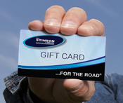 Image capturing a man's hand holding a Stinson gift card