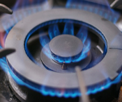 Imagine of a a close-up scene of a propane burner with vivid flames dancing gracefully